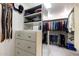 Large walk-in closet with ample shelving and hanging space at 245 W Berridge Ln, Phoenix, AZ 85013