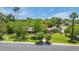 Charming home with lush green lawn, mature trees, and beautiful landscaping, providing great curb appeal at 245 W Berridge Ln, Phoenix, AZ 85013