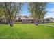 Ranch style home with mature landscaping and spacious lawn at 245 W Berridge Ln, Phoenix, AZ 85013