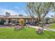Mid-century modern home with a landscaped yard and walkway at 245 W Berridge Ln, Phoenix, AZ 85013