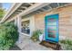 Mid-century modern home with a bright blue front door at 245 W Berridge Ln, Phoenix, AZ 85013