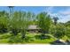 Charming home with lush green lawn, mature trees, and beautiful landscaping, providing great curb appeal at 245 W Berridge Ln, Phoenix, AZ 85013