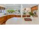 Bright kitchen featuring stainless steel appliances, custom cabinets and stone floors at 245 W Berridge Ln, Phoenix, AZ 85013