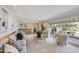 Bright living room with large picture window, neutral tones and a stylish bar area at 245 W Berridge Ln, Phoenix, AZ 85013
