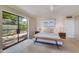 Spacious main bedroom with a walkout to the lush backyard with new paint and trim at 245 W Berridge Ln, Phoenix, AZ 85013