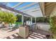 Built-in outdoor kitchen with grill and pergola at 245 W Berridge Ln, Phoenix, AZ 85013