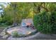 Relaxing patio with seating area nestled amongst bamboo and greenery at 245 W Berridge Ln, Phoenix, AZ 85013
