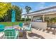 Outdoor kitchen and fire pit on flagstone patio at 245 W Berridge Ln, Phoenix, AZ 85013