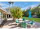 Fire pit and seating area on flagstone patio at 245 W Berridge Ln, Phoenix, AZ 85013