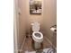 Clean bathroom with toilet and wall art at 29316 N Lone Pine Ln, Rio Verde, AZ 85263