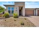 Front entrance of a single-story home with attractive landscaping at 29316 N Lone Pine Ln, Rio Verde, AZ 85263