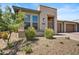 Modern home exterior with drought-tolerant landscaping at 29316 N Lone Pine Ln, Rio Verde, AZ 85263