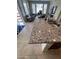 Granite kitchen island with sink and breakfast bar seating area at 29316 N Lone Pine Ln, Rio Verde, AZ 85263