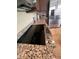 Modern kitchen with stainless steel stovetop and granite countertops at 29316 N Lone Pine Ln, Rio Verde, AZ 85263