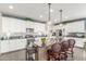 Modern kitchen with white cabinets, granite countertops and island at 3852 E Liberty Ln, Gilbert, AZ 85296