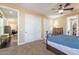 Bedroom with sliding door and views into a sitting area at 42516 N Suburban Ave, San Tan Valley, AZ 85140