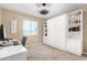 Versatile bedroom with a Murphy bed and workspace at 4301 N 21St St # 24, Phoenix, AZ 85016