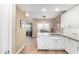Open kitchen with island, stainless steel appliances, and light wood floors at 4301 N 21St St # 24, Phoenix, AZ 85016