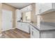 Laundry area with white cabinets and grey countertops at 4301 N 21St St # 24, Phoenix, AZ 85016
