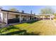 Large backyard with grassy area and covered patio at 4356 E Coconino St, Phoenix, AZ 85044