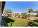 Landscaped backyard with grassy area and golf course view at 4356 E Coconino St, Phoenix, AZ 85044