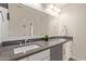 Bathroom with double vanity and dark gray countertop at 4356 E Coconino St, Phoenix, AZ 85044