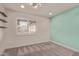 Bright bedroom with a stylish accent wall and carpet flooring at 4356 E Coconino St, Phoenix, AZ 85044