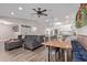Spacious living and dining area with a farmhouse-style table and open kitchen at 4356 E Coconino St, Phoenix, AZ 85044
