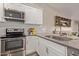 Modern kitchen with stainless steel appliances and gray countertops at 4356 E Coconino St, Phoenix, AZ 85044