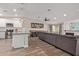 Modern kitchen with white cabinets, stainless steel appliances, and a large island at 4356 E Coconino St, Phoenix, AZ 85044