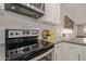 Kitchen details showcasing stainless steel range and white subway tile backsplash at 4356 E Coconino St, Phoenix, AZ 85044
