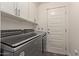 Convenient laundry room with washer, dryer, and cabinets at 4356 E Coconino St, Phoenix, AZ 85044
