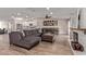 Open floor plan with a gray sectional and views of the kitchen and fireplace at 4356 E Coconino St, Phoenix, AZ 85044
