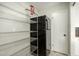 Functional pantry with wire shelving and a refrigerator at 4939 E Paradise Dr, Scottsdale, AZ 85254