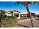 Covered patio with seating area, mature trees, and a desert landscape at 5028 S Peachwood Dr, Gilbert, AZ 85298