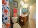 Cozy bathroom featuring bright natural light and unique floral shower curtain at 5028 S Peachwood Dr, Gilbert, AZ 85298