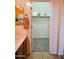 Bathroom with a single sink vanity, mirror, and open doorway to a walk-in closet at 5028 S Peachwood Dr, Gilbert, AZ 85298