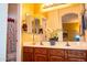 Spacious bathroom featuring double sinks, a large mirror, and ample cabinet space at 5028 S Peachwood Dr, Gilbert, AZ 85298