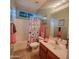 Cozy bathroom with a shower-tub combo, stylish vanity, and decorative accents at 5028 S Peachwood Dr, Gilbert, AZ 85298