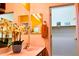 Half bathroom featuring a decorative mirror, a walk-in closet, and a sink at 5028 S Peachwood Dr, Gilbert, AZ 85298