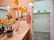 Bathroom featuring a single sink vanity, mirror, and doorway to a walk-in closet at 5028 S Peachwood Dr, Gilbert, AZ 85298