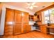 Bedroom with a Murphy bed, built in desk and storage cabinets and hardwood floors at 5028 S Peachwood Dr, Gilbert, AZ 85298