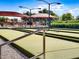 Bocce ball court featuring shaded seating areas and well-maintained playing surface, perfect for outdoor recreation at 5028 S Peachwood Dr, Gilbert, AZ 85298