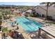 Aerial view of the community pool featuring a lap pool, lounge chairs, and shaded seating areas at 5028 S Peachwood Dr, Gilbert, AZ 85298