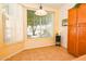 Sunny dining area with tile floors and a large window with views of the backyard at 5028 S Peachwood Dr, Gilbert, AZ 85298