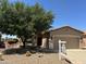 Charming single-story home featuring a well-manicured desert landscape and inviting front porch at 5028 S Peachwood Dr, Gilbert, AZ 85298