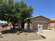 Charming single-story home featuring a well-manicured desert landscape and inviting front porch at 5028 S Peachwood Dr, Gilbert, AZ 85298