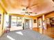 Open concept living room featuring carpet, a ceiling fan, and sliding door to the back yard at 5028 S Peachwood Dr, Gilbert, AZ 85298