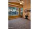 This living room has neutral carpet, bay windows, and modern decor at 5028 S Peachwood Dr, Gilbert, AZ 85298