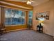 Bright living room featuring neutral carpet, bay windows, and modern decor at 5028 S Peachwood Dr, Gilbert, AZ 85298